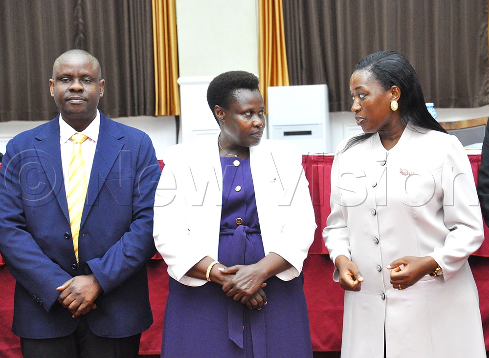 (L-R) Local Government Minister Balaam Barugahara looks on as Vice President Jessica Alupo interacts with State Minister for Local Government Justine Nameere during the Ministry of Local Government meeting with local government leaders on the implementation of the President’s directive to eliminate corruption in Uganda at Hotel Africana, Kampala, on August 5, 2026. (Photo by Nancy Nanyonga)