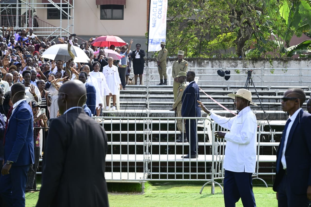 President Museveni waves to the faithful.