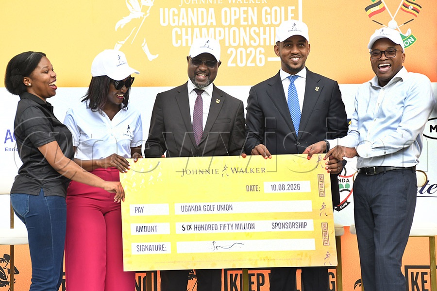 Edward Kimathi (right) Commercial Director at UBL shares a light moment with Denise Paula Nazzinda (left), Christine Kyokunda, Jackson Were and Paul Rukundo during the launch of this year's Johnnie Walker Uganda Open at Kitante. Photo by Michael Nsubuga