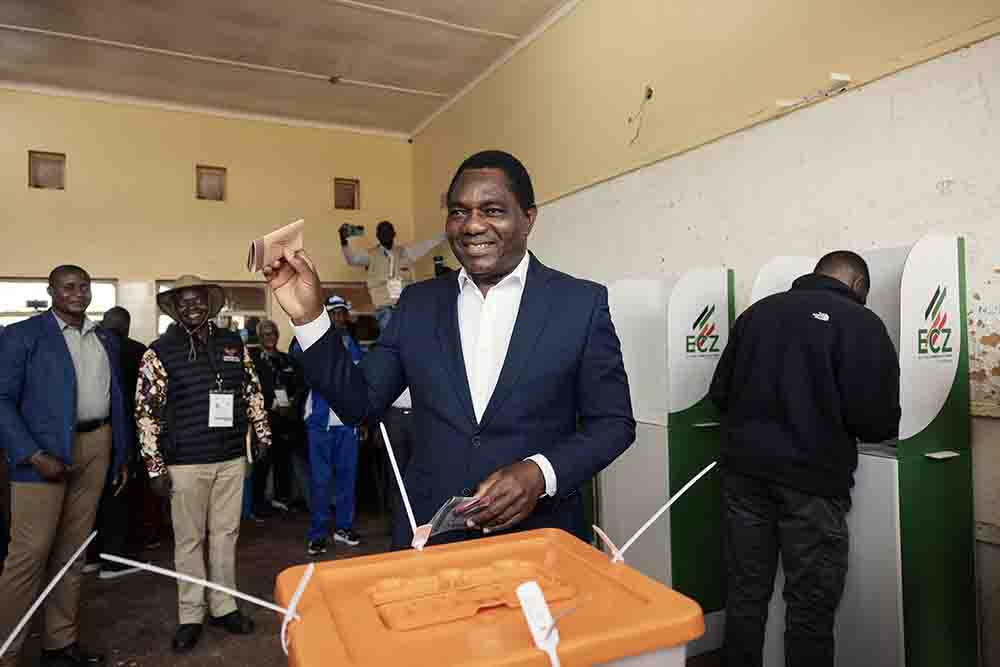 Zambian incumbent President and United Party for National Development (UPND) presidential candidate Hakainde Hichilema casts his ballot at the Kabulonga Boys Secondary School polling station in Lusaka on August 13, 2026.