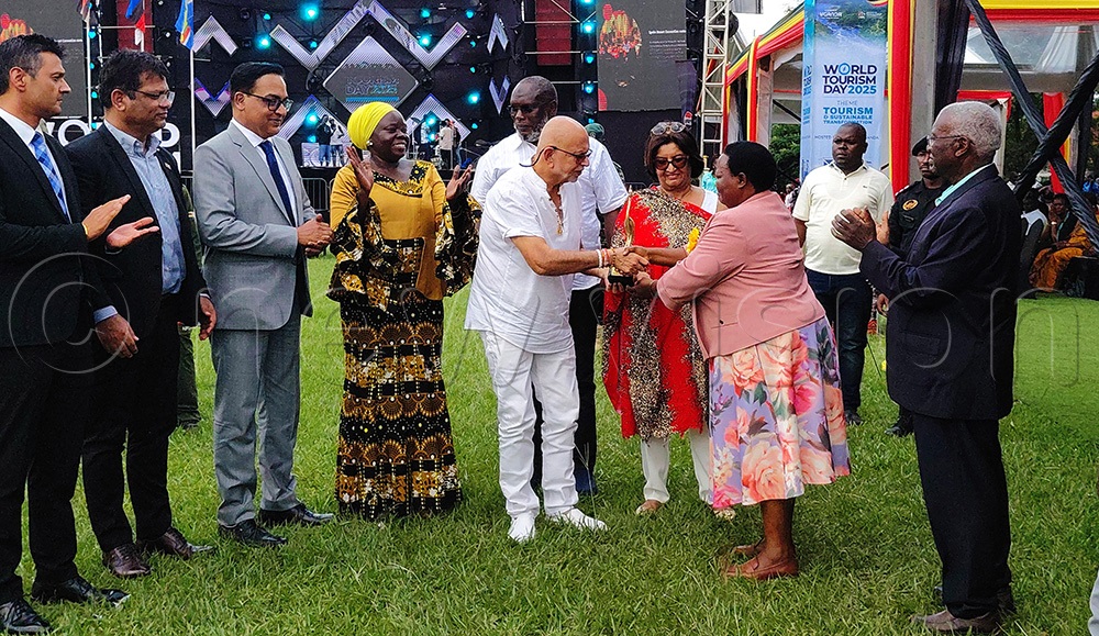 Prime minister Robinah Nabbanja awards businessman Sudhir Ruparelia as the best entrepreneur during the World Tourism Day celebration in Arua City. (Photo by Robert Adiga)