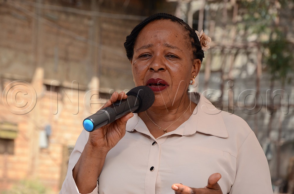 Juliet Nambi Namuddu, the KCCA Director Education and Social Services speaking during the hand over ceremony of gardening equipment at Nakivubu Blue Primary School in Kampala on Tuesday