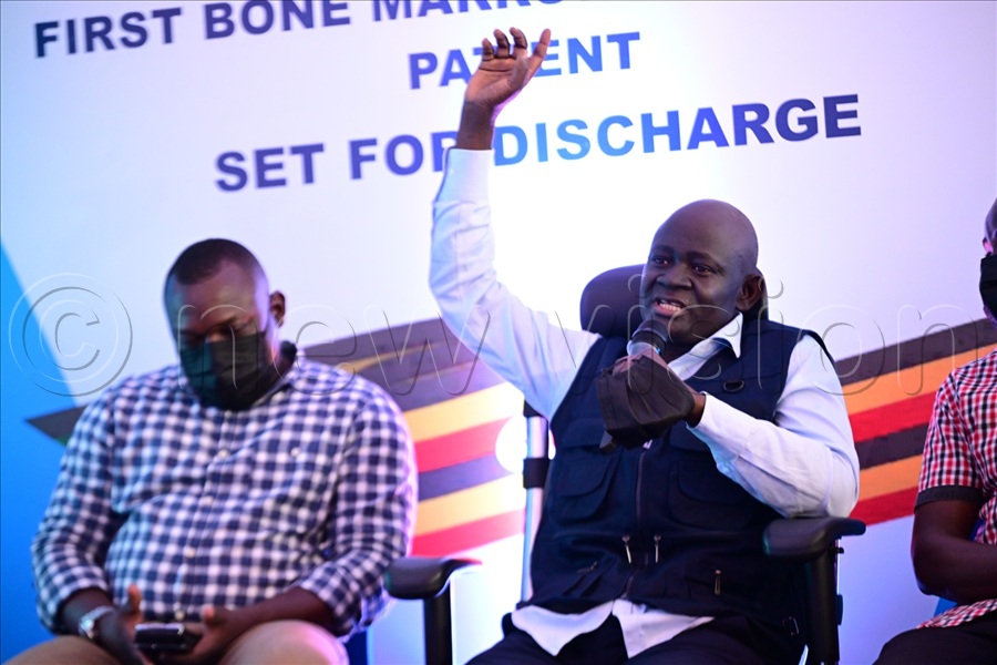 The first bone marrow transplant patient Stephen Sande accompanied by his caretakers Wilson Sande and Andrew Ayazika makes his remarks during discharge at Uganda Cancer Institute.