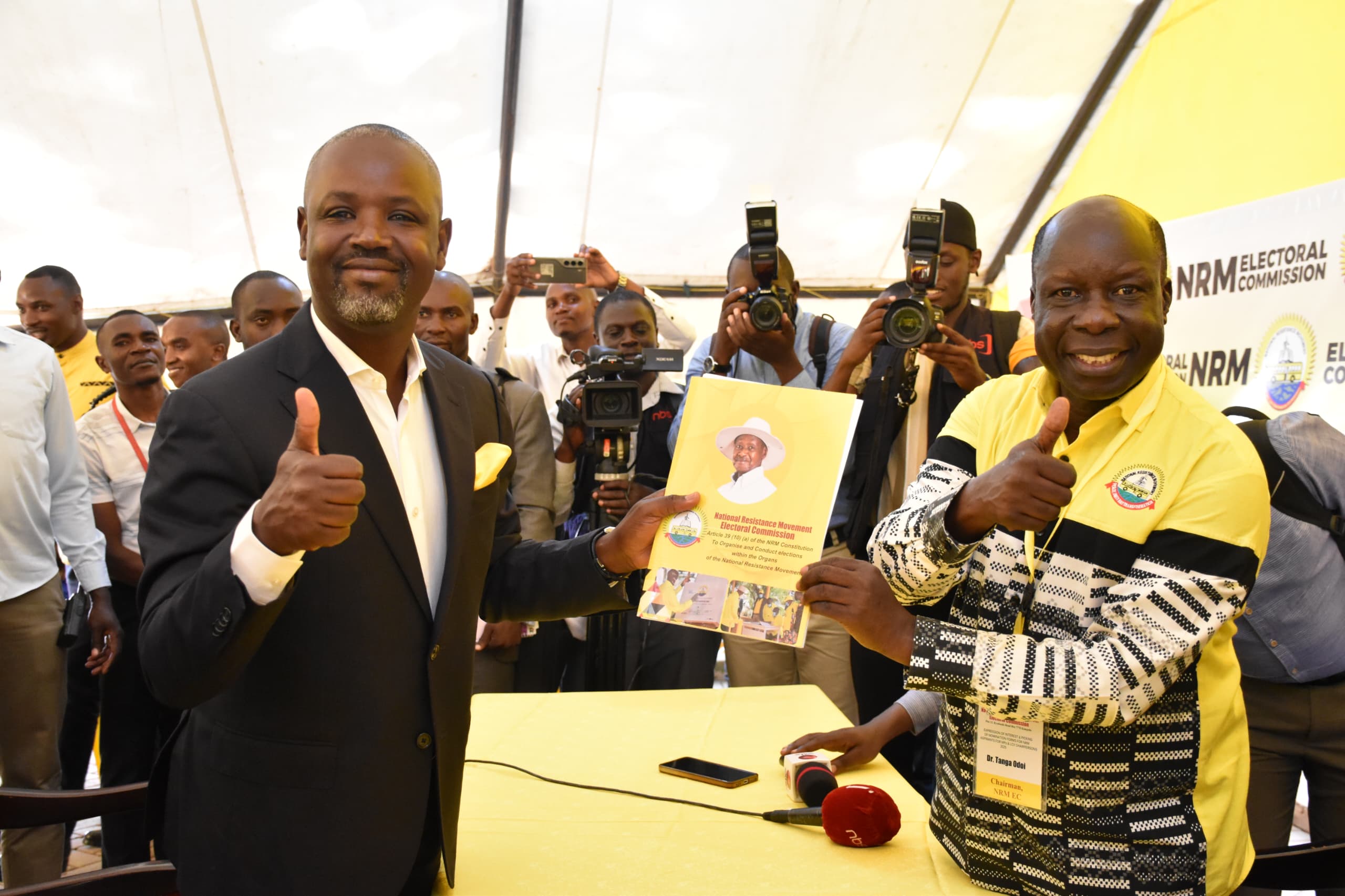  Deputy Speaker of Parliament Thomas Tayebwa and Dr. Tanga Odoi, the NRM electoral Commission chairperson sharing a light moment shortly after picking nomination forms.