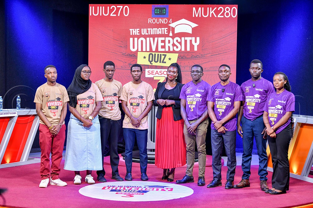 The quiz mistress, Lydia Lakwonyero (centre) in a group photo with students from Islamic University in Uganda (IUIU) on the left and Makerere University students on the right as they faced off in Ultimate University Quiz Season Three. (Photo by Miriam Namutebi)