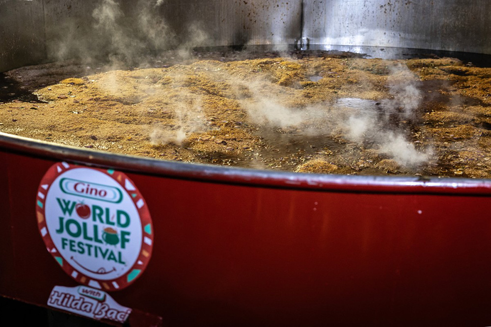 Rice simmers is seen in a giant pot during an attempt to break the world record for the largest pot of Jollof rice, led by Nigerian chef Hilda Baci in Lagos, on September 12, 2025. (Photo by OLYMPIA DE MAISMONT / AFP)