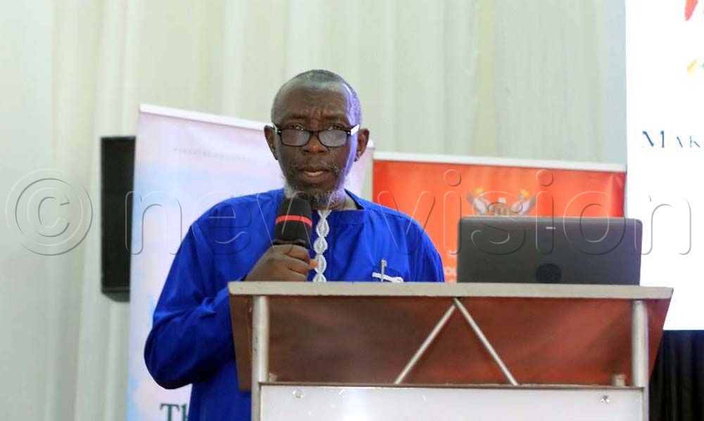 Prof. Abas Kiyimba, a lecturer in the department of literature at Makerere University, delivering a keynote address at the Ngũgĩ wa Thiong’o Memoriam held at Makerere University’s Main Hall. (Credit: John Odyek)