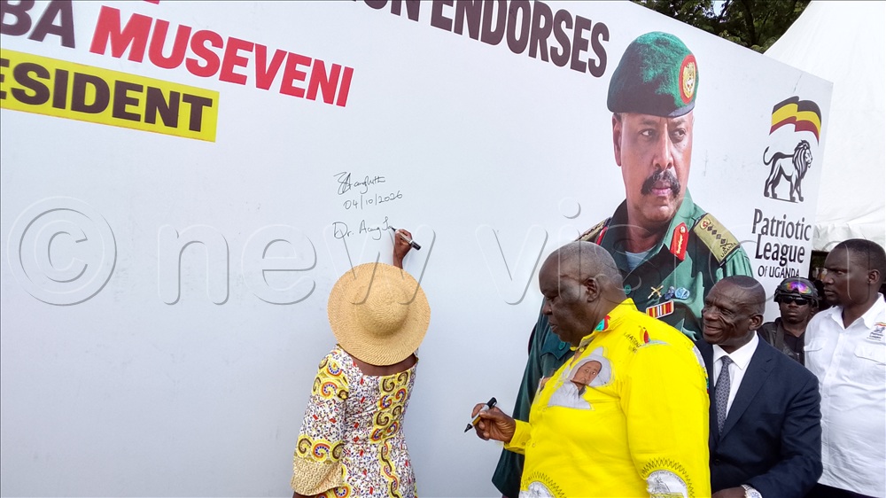 Lira City Woman MP and Government Chief Whip, Dr Jane Ruth Aceng, signs the endorsement for Gen. Muhoozi Kainerugaba's presidential bid as Minister Engola and other leaders line up to append their signatures of endorsement at Lira City Mayor's Garden.