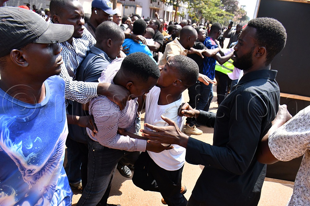 Some of the supporters of NUP's Robert Ssemakula (not in picture) in a scuffle with supporters of Sazil Kawoma (not in picture) during the LC1 chairperson elections at Iganga Road Cell in Jinja City on Tuesday. (Credit: Donald Kiirya)