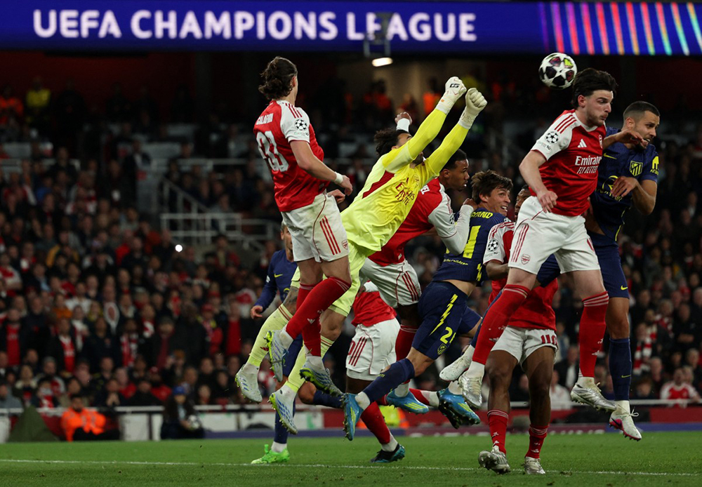 Arsenal's Spanish goalkeeper #01 David Raya punches the ball away during the UEFA Champions League second-leg semi-final football match between Arsenal and Atletico Madrid at the Emirates Stadium in north London on May 5, 2026. (AFP)