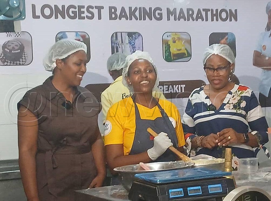 Deputy Speaker's wife Anita Tayebwa (left) visits Becky Bakes, who is attempting the longest baking Guinness World Record at The Velocity in Kyanja