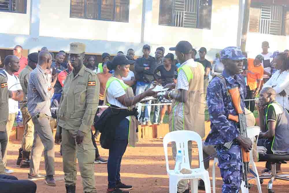 Polling officials count the votes amidst tight security deployment. (Credit: Henry Nsubuga)