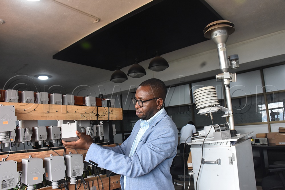 Makerere University Professor Engineer Bainomugisha holds part of low cost sensor. (Photo by Gerald Tenywa)