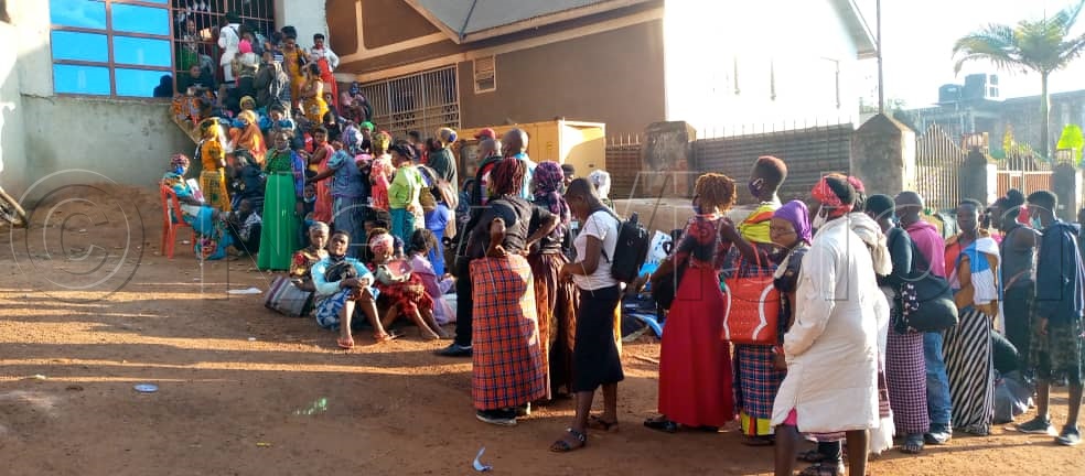 Believers wait to pay their last respects to Yiga. Photo by Edith Namayanja