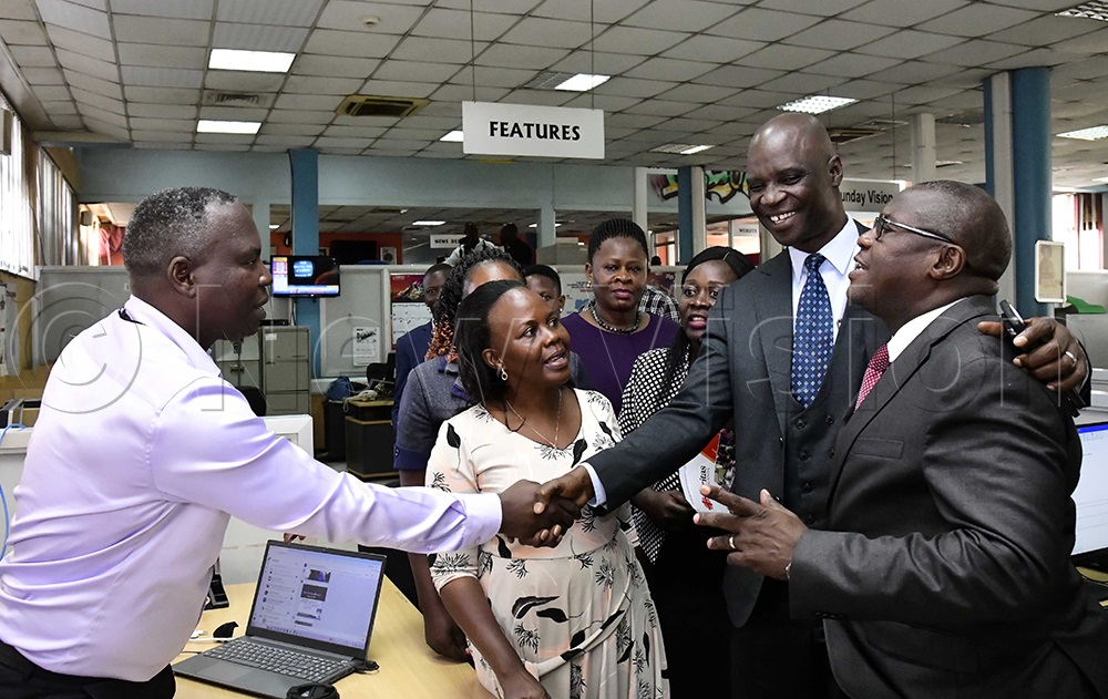 The head of Bukedde newspaper, Michael Mukasa Ssebowa, welcoming Wakiso district leaders to the New Vision head offices on July 29, 2025. Right is the LC5 chairman, Matia Lwanga Bwanika and the CAO, Alfred Malinga (second right). (Photo by Eddie Ssejjoba)