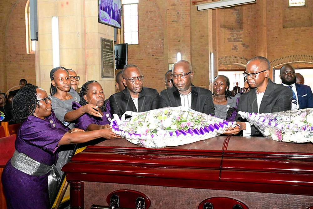 Some of the children of the late Bishop Christopher Ssenyonjo lay a wreath on his casket during the funeral service at Namirembe Cathedral on July 24, 2026. (Credit: Eddie Ssejjoba)