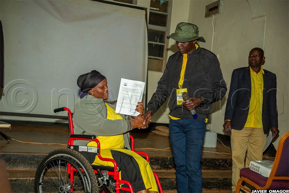 Betty Cheptoek Kaali being congratulated by the NRM acting district returning officer, Isaac Chepkurui, who declared her winner of the Kapchorwa NRM primary elections re-run.