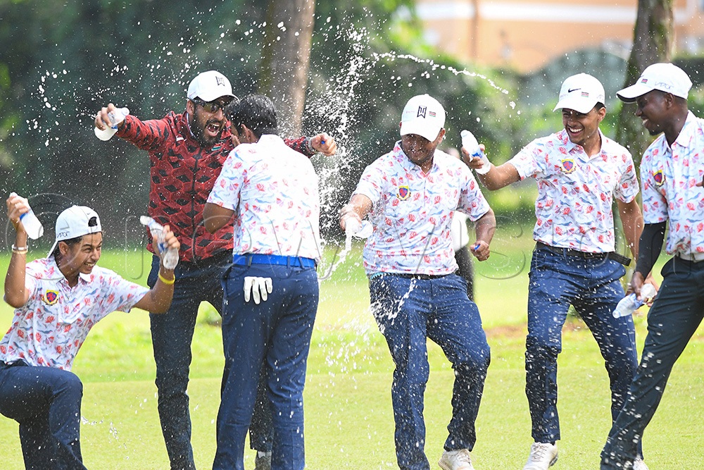 Kenyan player Junaid Manji (3rd left) is joined by teammates in celebration after winning his game against Andrew Ssekibejja on the 17th hole at Entebbe Club on March 7, 2026. Kenya won on 15.5-10.5 points. (Photo by Michael Nsubuga)
