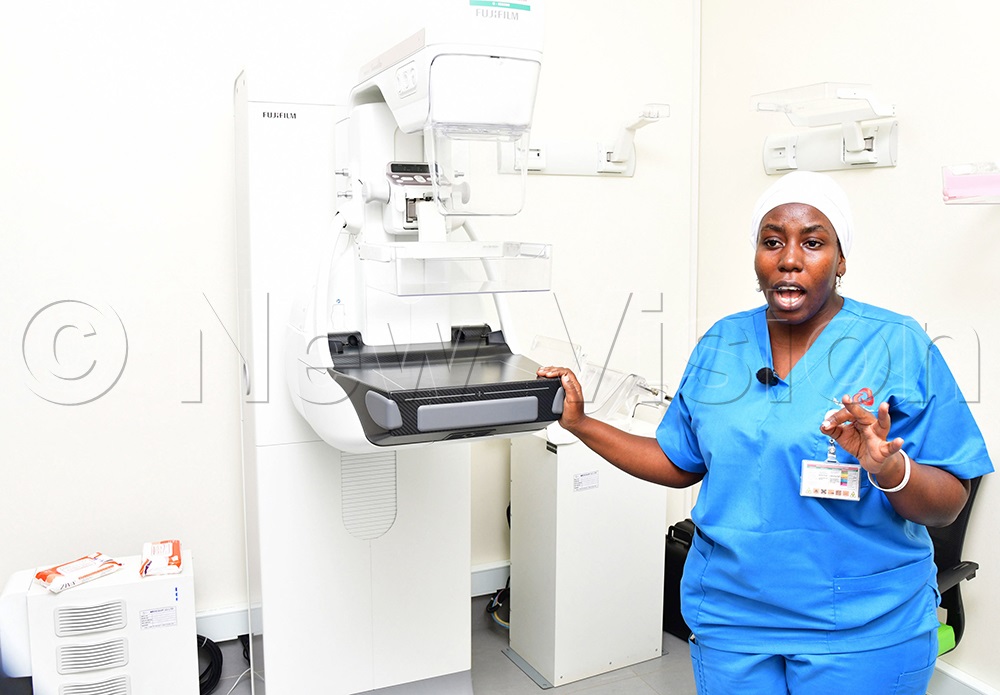 Oncology nurse Kuluthum Ndagire explaining about the mammography machine used for breast cancer testing. This was during a media engagement on cancer awareness and education at Aga Khan hospital on Wednesday, May 13, 2026. (Photo by Mpalanyi Ssentongo)