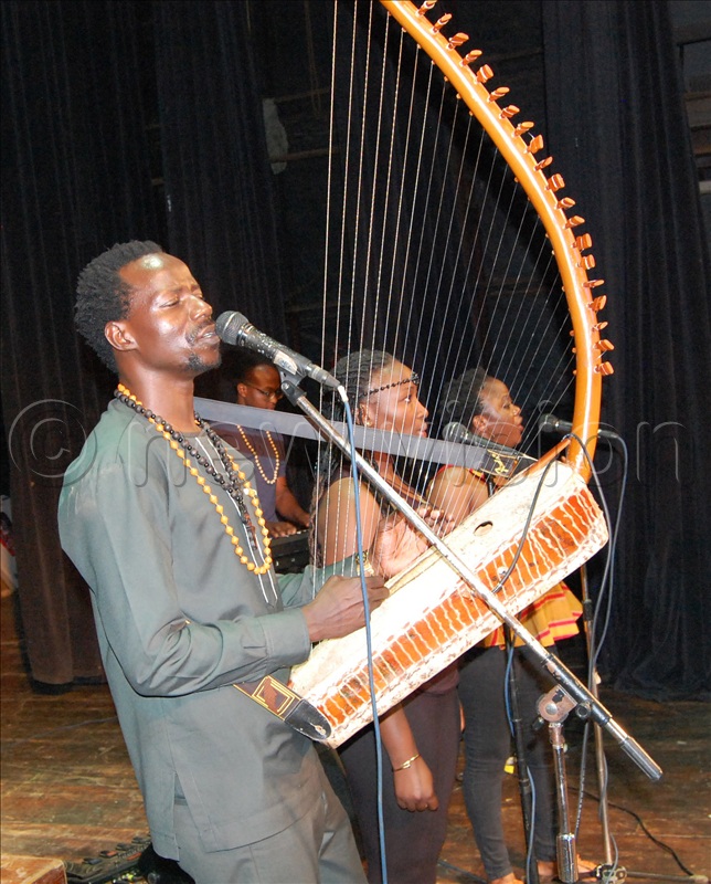 Revolutionary Band's Adungu maestro Charles Obina in action during the entertainment break.