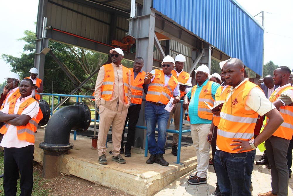 MPs inspect the water treatment plant in Bugondha. (PHOTOS BY TOM GWEBAYANGA)