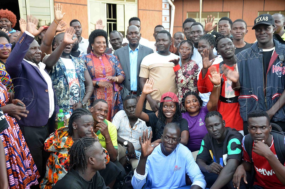 Gender minister Betty Amongi (middle) posses for a group photo with creatives in Lira City. (Photo by Patrick Okino)