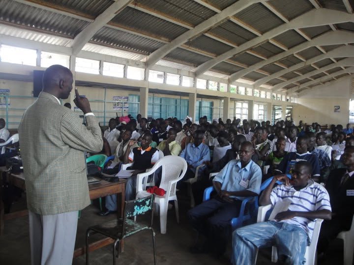Sam Watulatsu speaking to the youth from Teso.