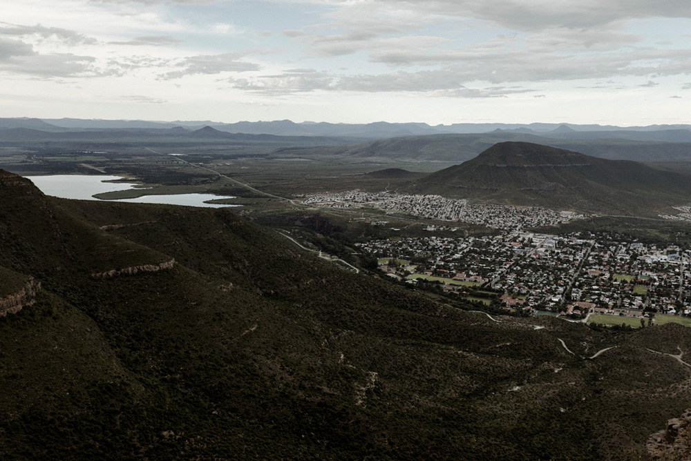 A general view of the town of Graaff-Reinet, on March 4, 2026. Beneath flamboyant trees and the whitewashed gables of Cape Dutch houses, a battle over a new name is unsettling the tranquil South African town of Graaff-Reinet. (Photo by MARCO LONGARI / AFP)