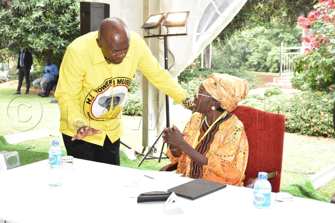 Baryomunsi and Kadaga having a chat.