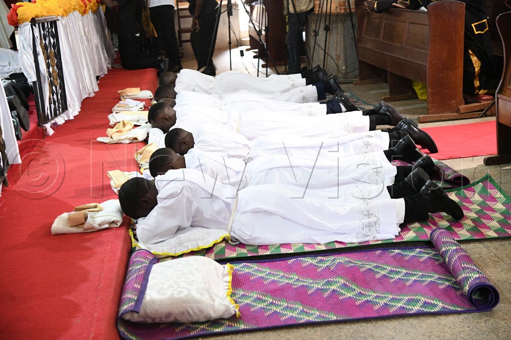 Priests to be lay down during the ordination mass. (Credit: Maria Wamala)
