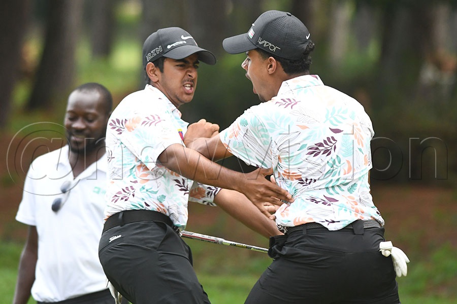 Yuvraj Rajput (left) celebrates his eagle chip on hole 13 with Tsevi Soni, March 6, 2026. Photo by Michael Nsubuga