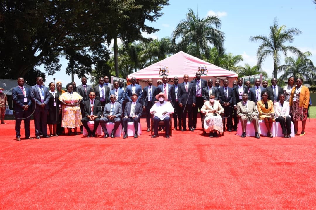 President Museveni with the First Lady and Minister of Education and Sports, Janet Museveni, in a group photo with  some of the delegates of Uganda Development Finance Summit at Speke Resort, Munyonyo.