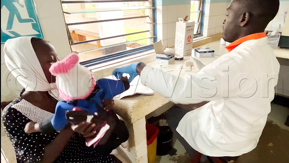 Nakato Barbara's baby gets tested for malaria. (Credit: Raziah Athman) 