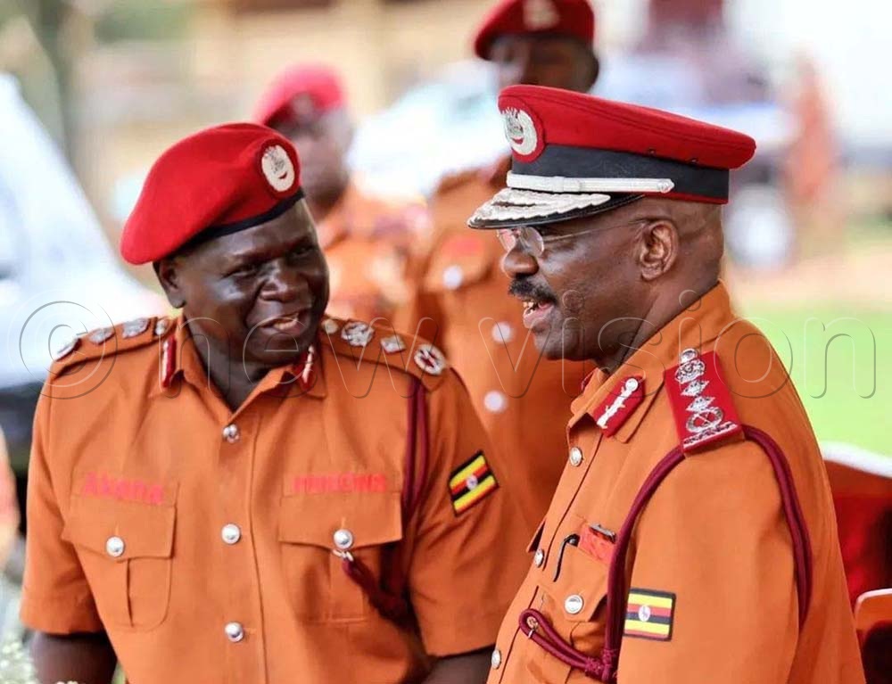 (R-L) Dr Johnson; Byabashaija; the Commissioner General of Uhanda Prisons shares a light moment with the Deputy Commissioner General of Prisons Samuel Akena shortly after the prison council conference at Serena; Kigo recently. (Credit: Petride Mudoola)
