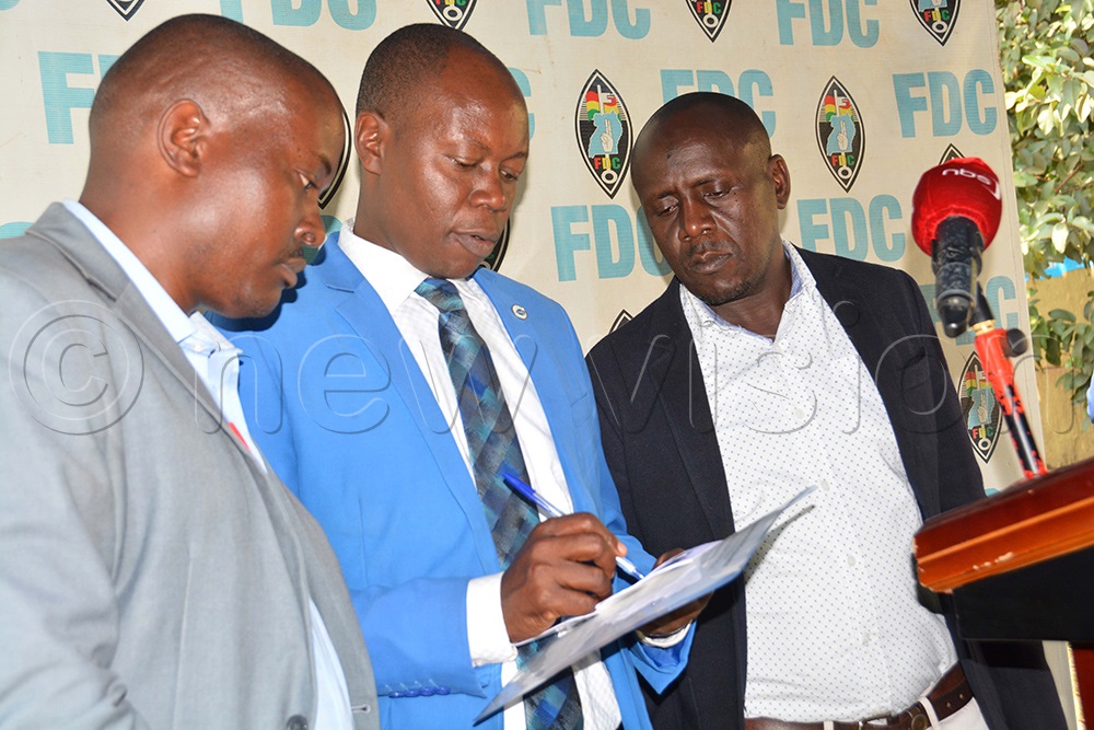 FDC leaders (L-R) Richard Muyombya, Okwera Mugisha and Kassim Kyazze interacting after addressing a press conference at the party headquarters in Najjanakumbi, Kampala on July 28, 2025. (Photo by Francis Emorut)