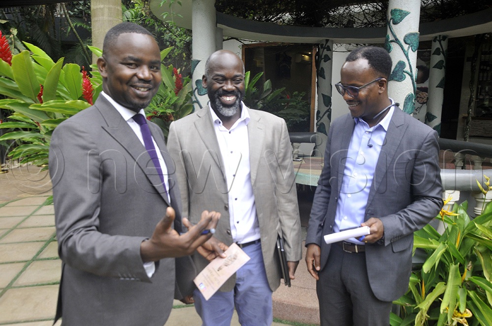 Commissioner for Reproductive, Maternal and Child Health at the Uganda Ministry of Health (MOH) Richard Mugahi, Paul Mbaka, Assistant Commissioner Health Safety Information Management and Kenneth Mwehonge, the Executive Director (HEPS-Uganda) at the launch of the digital system aimed at strengthening the health information system in the country. (Photo by Wilfred Sanya)