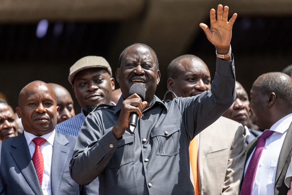 Kenya's veteran politician Raila Odinga (C) addresses his supporters after he officially signed a political cooperation deal with President William Ruto in a bid to boost his presidency after months of turmoil, in Nairobi on March 7, 2025.