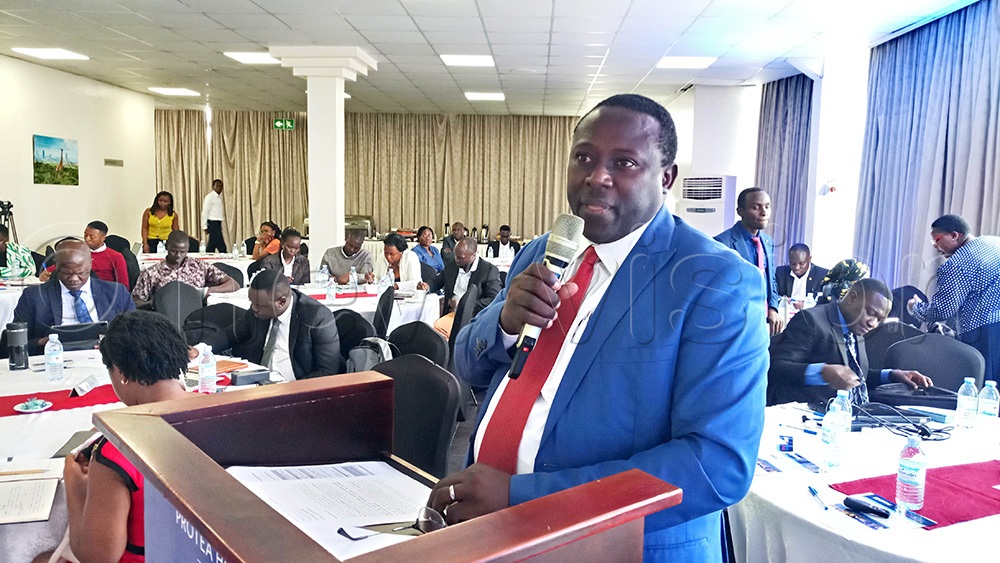 The Commissioner for Processing and Marketing at the Trade Ministry, Joshua Mutambi, addressing participants during the dissemination of business climate index findings at Skyz Hotel in Kampala. (Photo by Francis Emorut)