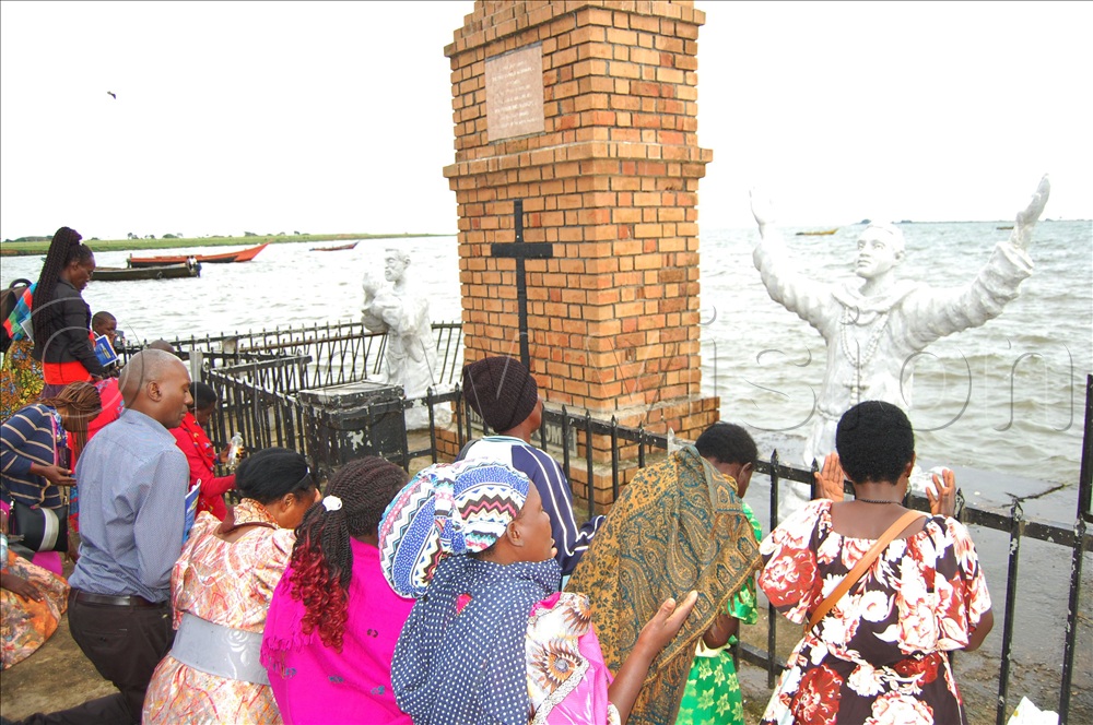 Christians praying at the spot at Kigungu Landing Site where the pioneer missionaries, Fr. Lourdel Mapeera (White Father) and Bro. Delmas Amans (White Father) first set foot upon their arrival in Uganda on February 17, 1879. 