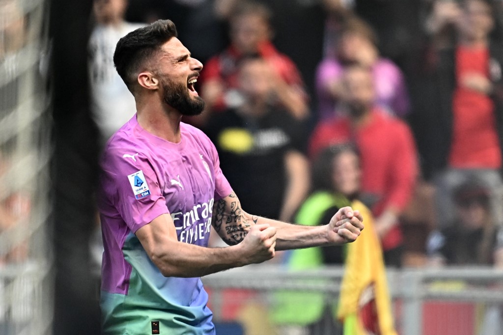 AC Milan's French forward #09 Olivier Giroud celebrates after scoring his team's second goal during the Italian Serie A football match between AC Milan and Lecce at San Siro Stadium, in Milan on April 6, 2024. 