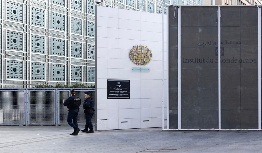 French police officers patrol in front of the Institut du Monde Arabe (IMA - Arab World Institute) during a search as part of investigations entrusted to the National Anti-Fraud Office (ONAF) on the Epstein case linked to its president Jack Lang, at the Institut du Monde Arabe in Paris on February 16, 2026. (Photo by Charlotte SIEMON / AFP)