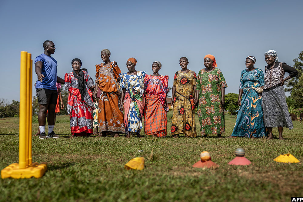  Elderly women, locally known as the &ldquo;cricket grannies&rdquo;, receive instructions from a coach during a cricket and physical training session in Jinja.