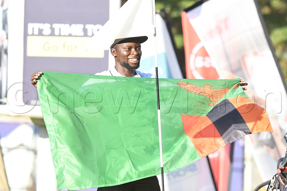 Dominic Musonda celebrates with the Zambian flag after he won the Uganda Open at Kitante on August 28, 2026. (Photo by Michael Nsubuga)