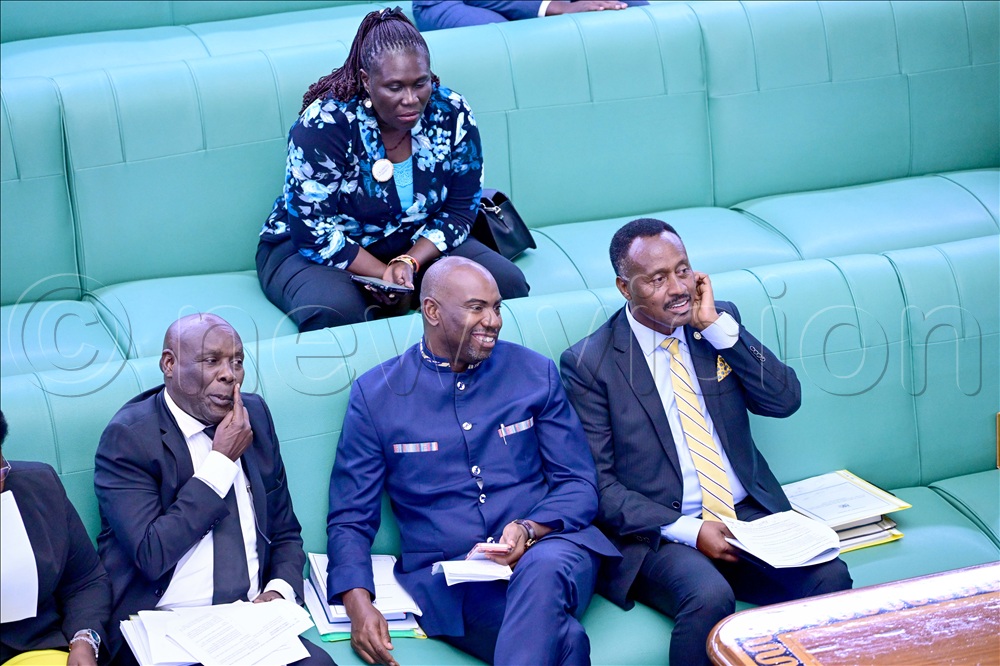 (left to right) Opolot Okaasai, Minister for State for Energy,  Sheema Municipality MP Dickson Kateshumbwa, and Finance Committee Chairperson Amos Kankunda  during plenary. This was on 23 April 2026. 