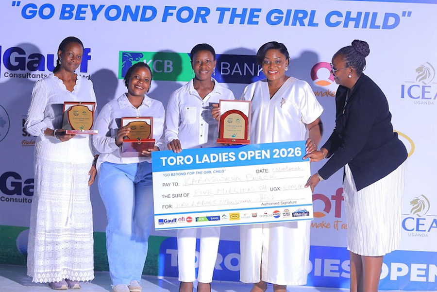 Queen Rebecca Amoding-Rukidi (second right) poses with the top three golfers: Harriet Kitaka (left), Judith Komugisha, Peace Kabasweka (centre) and Lucia Alinda (right) after  the Tooro Ladies Open. Courtesy photo