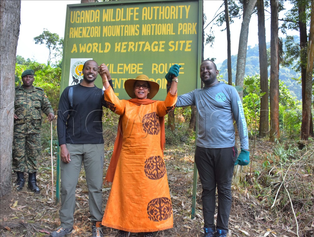 Best Kemigisha welcoming back her son King Oyo Kabamba Iguru (left) with his executive assistant prince Jonathan Baguma from their hiking expedition in 2022