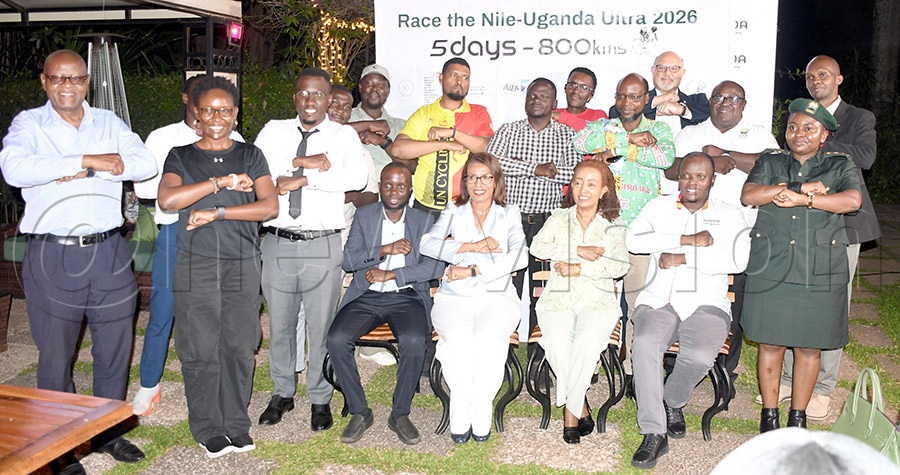Senior Presidential Advisor on Tourism in Uganda Lillian Ajarova (seated 2nd-left) and the other guests 'cycle' during the launch of the the Race the Nile Uganda Ultra cycling competition at Sheraton Hotel, August 24, 2026. Photo by Michael Nsubuga