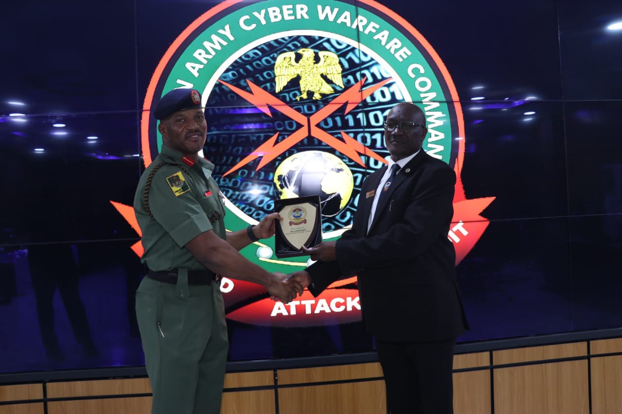 Brig. Gen. Kefa Nangeso Head of Delegation of intake 04 team to Nigeria Presents a gift to the Commandant NSWC while at the NSWC HQs in Abuja, Nigeria. (Courtesy)