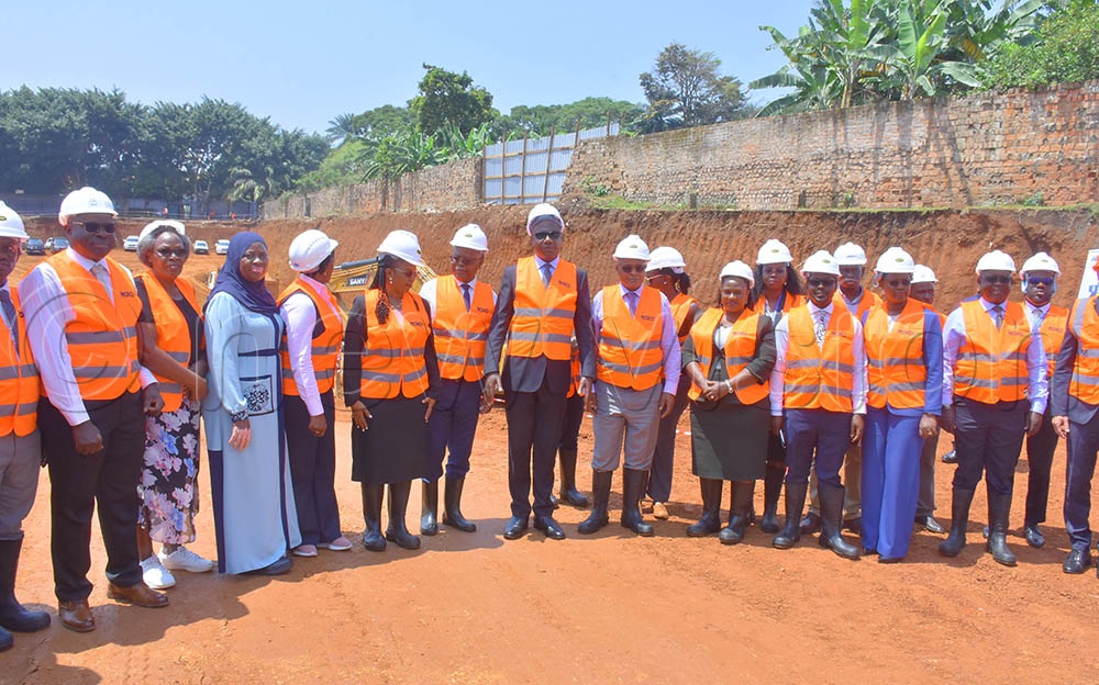 Some of the UBOS board members, management members and Entebbe leaders having a photo moment with minister Musasizi during the groundbreaking ceremony of the new Statistics house being constructed in Entebbe municipality. (Credit: Julius Luwemba)