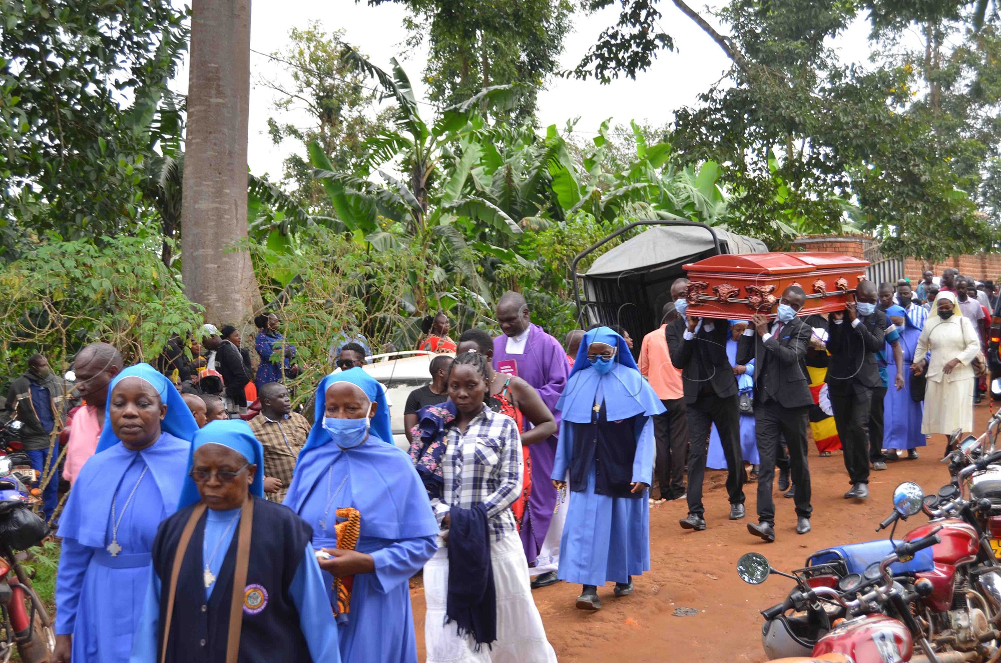 The funeral procession of Frank Kizito at Nabbingo, in Wakiso district on Friday, February 25, 2022. (Photo by Mathias Mazinga)